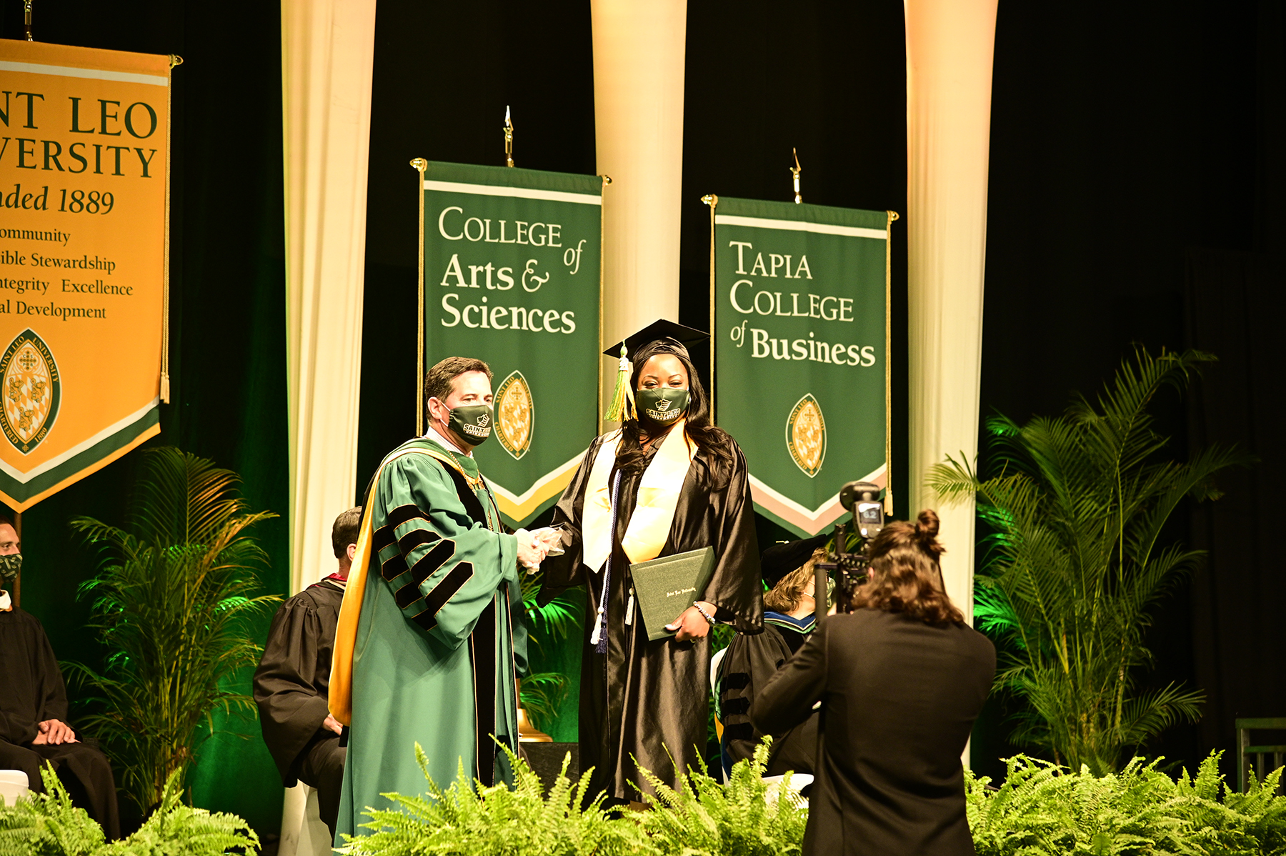 Saint Leo Commencement Grad on Stage